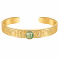Bracciale rigido dorato con pietra centrale verde